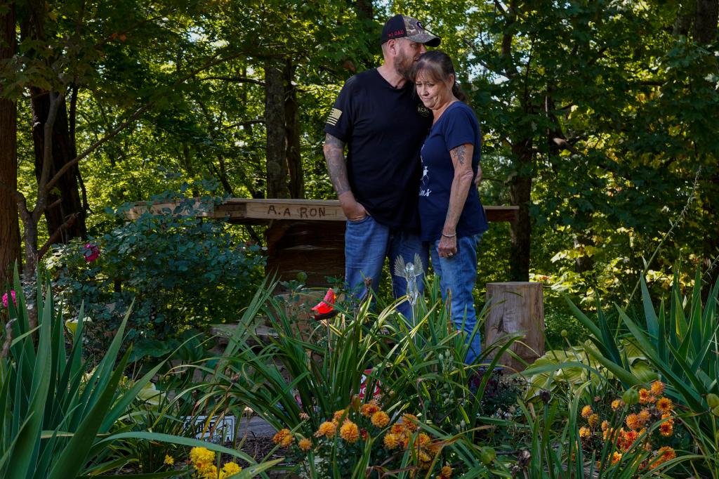 Brian and Karen Goodwin at a memorial for motorcycle riders that includes the name of Turner along US Highway 421.