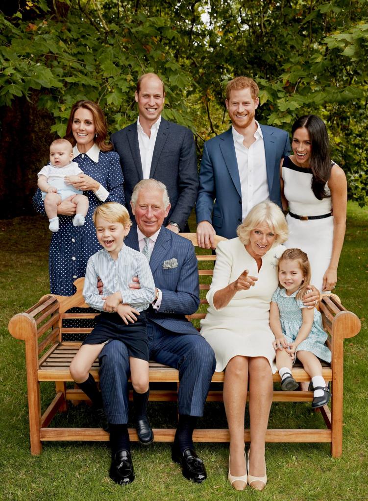 Prince Charles, Prince of Wales, with his family including Camilla, Duchess of Cornwall, Prince William, Catherine, Prince George, Princess Charlotte, Prince Louis, and Meghan, Duke and Duchess of Sussex, posing for a portrait in Clarence House gardens.