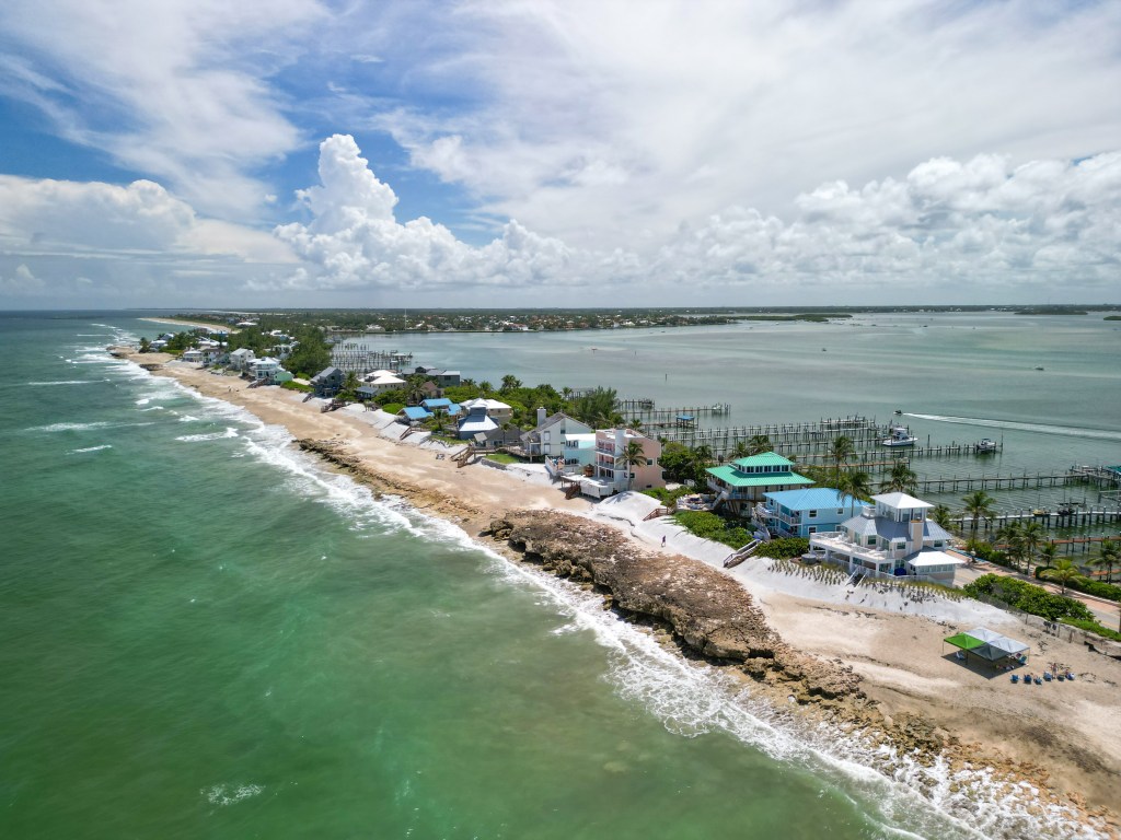 Aerial coastline view with oceanfront homes at Stuart Rocks Beach in Stuart, Florida. 