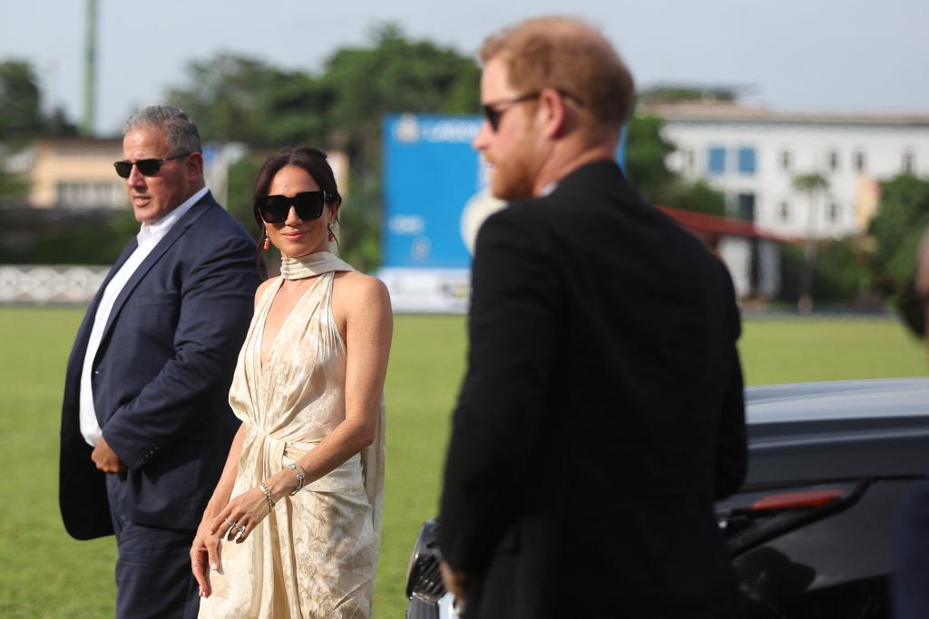 Britain's Meghan (C), Duchess of Sussex, and Britain's Prince Harry (R), Duke of Sussex, arrive at a charity polo game at the Ikoyi Polo Club in Lagos on May 12, 2024 as they visit Nigeria as part of celebrations of Invictus Games anniversary. 