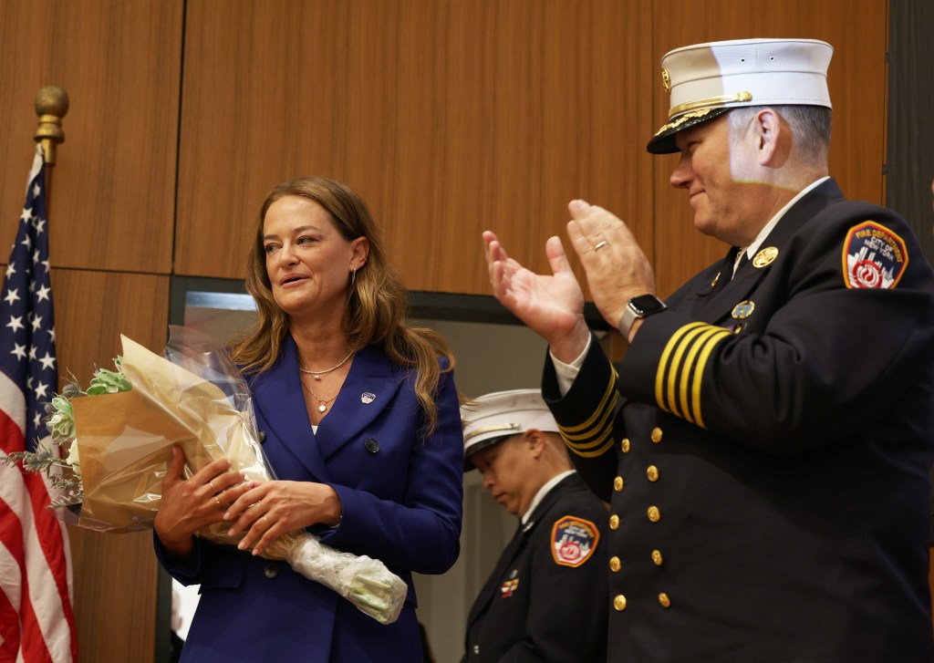 An emotional FDNY Commissioner Laura Kavanagh with Acting Chief of Department John Esposito, at the FDNY EMS Lieutenant Promotion at St. John's University.