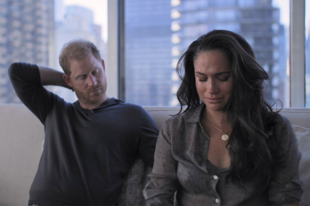 Prince Harry and Meghan Markle sitting on a couch, engaged in a Netflix show, reacting to a guided meditation instructor's voice.