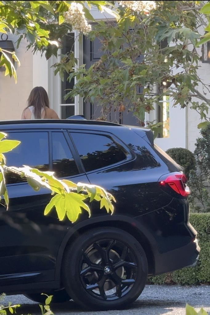 Photo of Jennifer Lopez arriving outside a house; a black SUV on the street. Jennifer Lopez arrived at Ben Affleck's LA rental home on Sunday night where she stayed for hours.