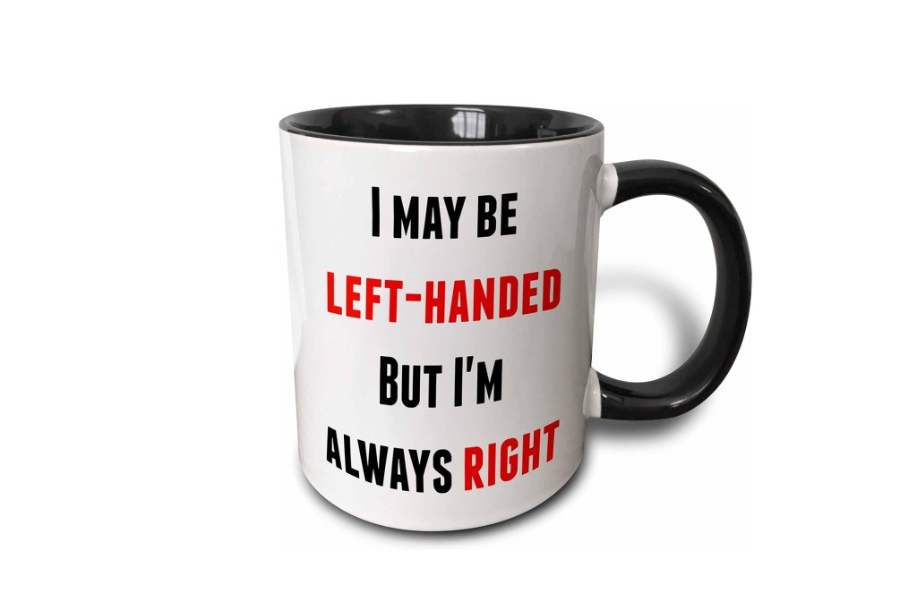 A white and black coffee mug with red text