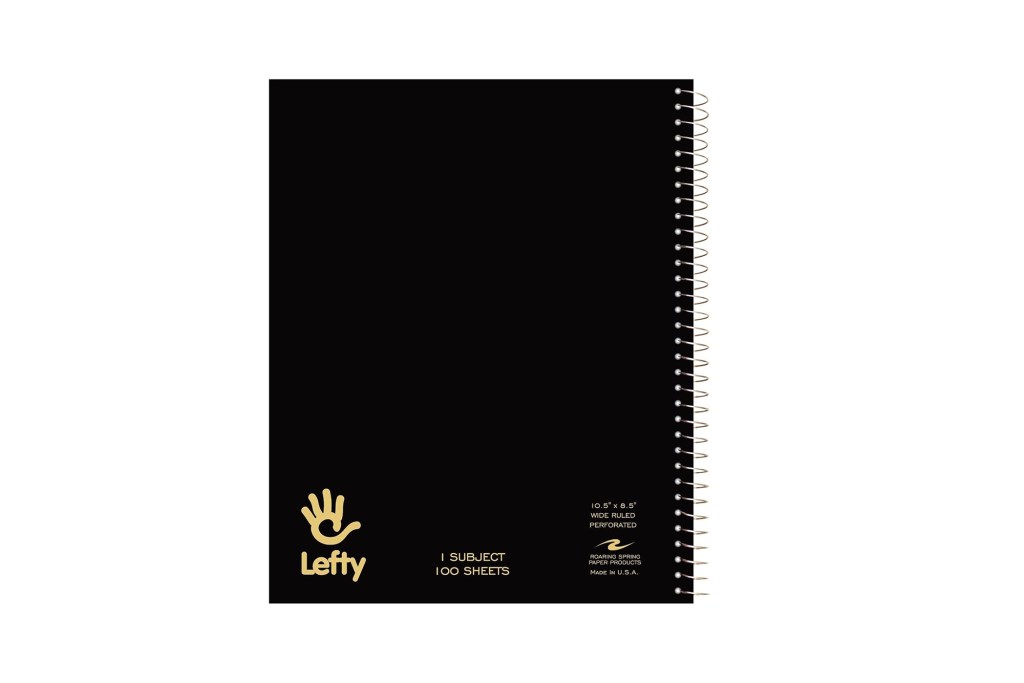 A black notebook with gold writing on it