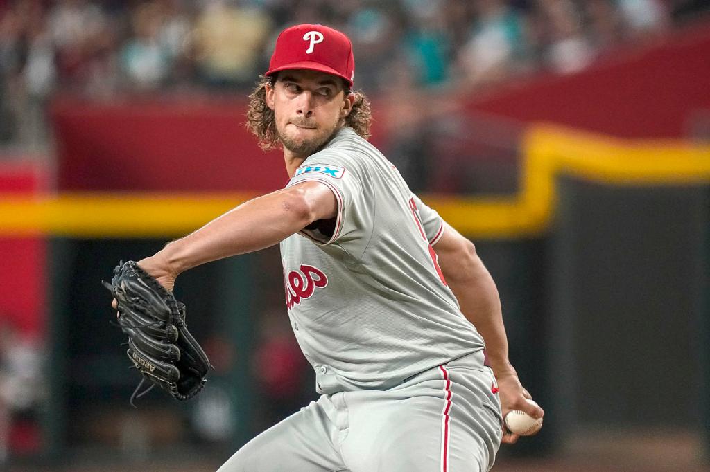 Philadelphia Phillies pitcher Aaron Nola (27) throws against the Arizona Diamondbacks during the first inning of a baseball game Saturday, Aug. 10, 2024, in Phoenix. 