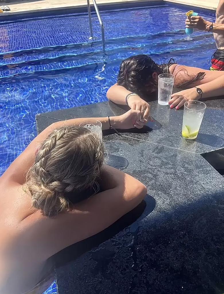 A horrifying photo captured the two friends passed out after ordering water from the bar.