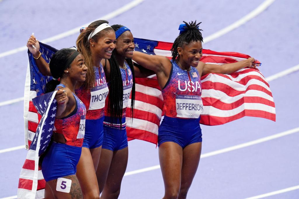 Melissa Jefferson (USA), Twanisha Terry (USA), Gabrielle Thomas (USA) and Sha'carri Richardson (USA) celebrate winning the women's 4x100m relay during the Paris 2024 Olympic Summer Games at Stade de France. 