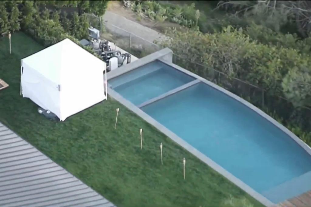 White tent in Matthew Perry's backyard where he was found deceased, with visible pool in the background