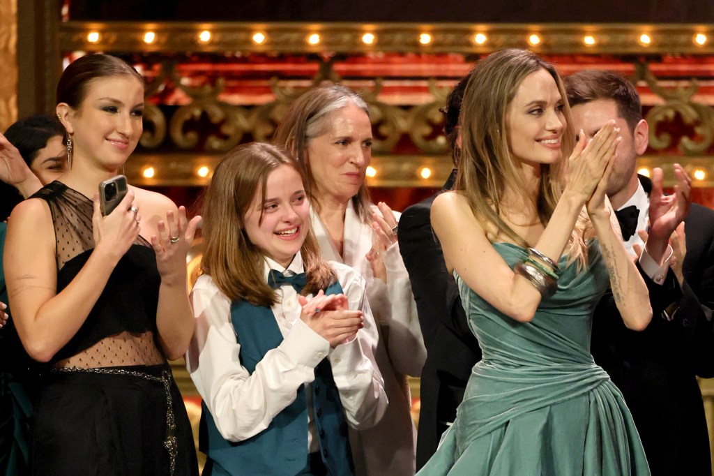 Angelina Jolie, her daughter Vivienne, and the cast and crew of 'The Outsiders' onstage accepting the Best Musical award at the 77th Annual Tony Awards