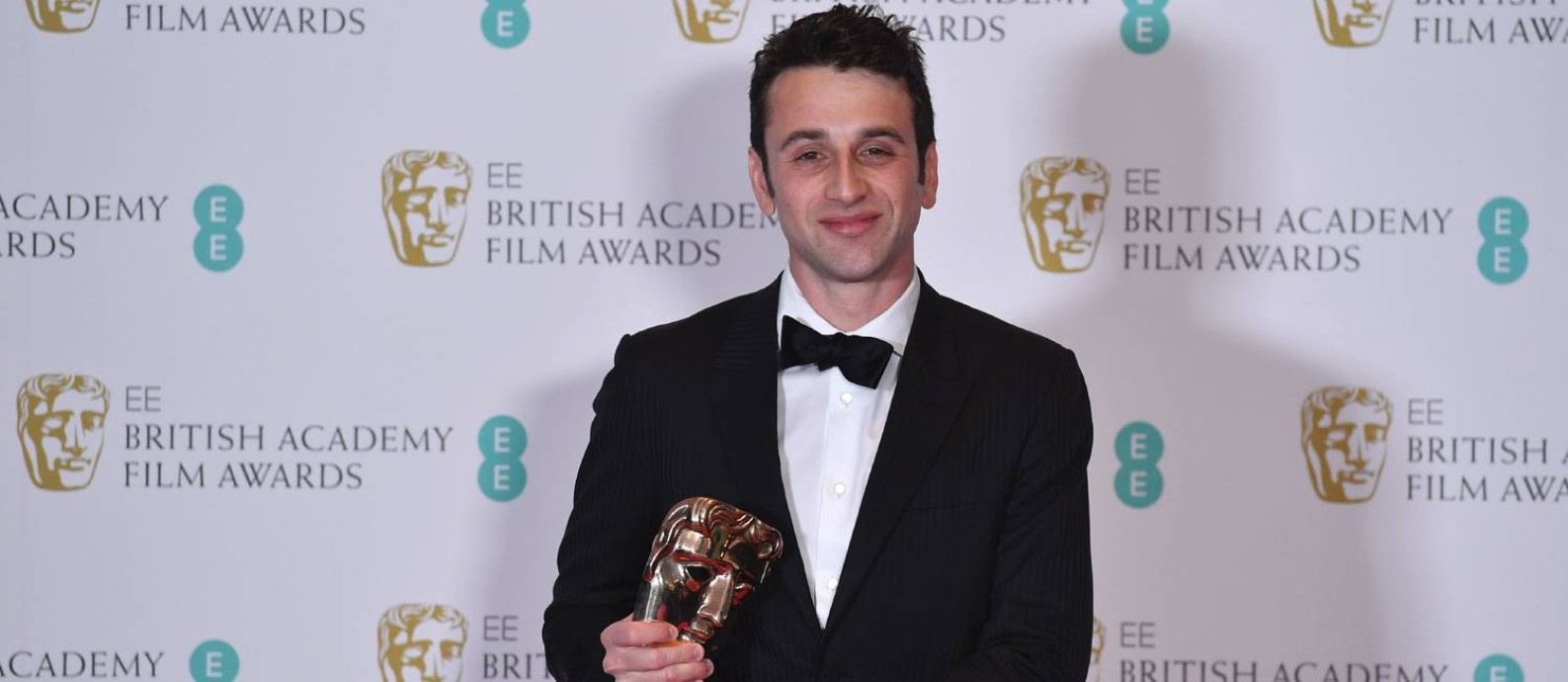 Justin Hurwitz recebe o Bafta de melhor trilha sonora, por 'La la land' Foto: BEN STANSALL / AFP