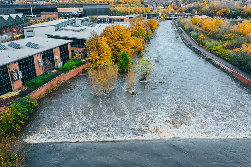 aerial image of a river flooding a building