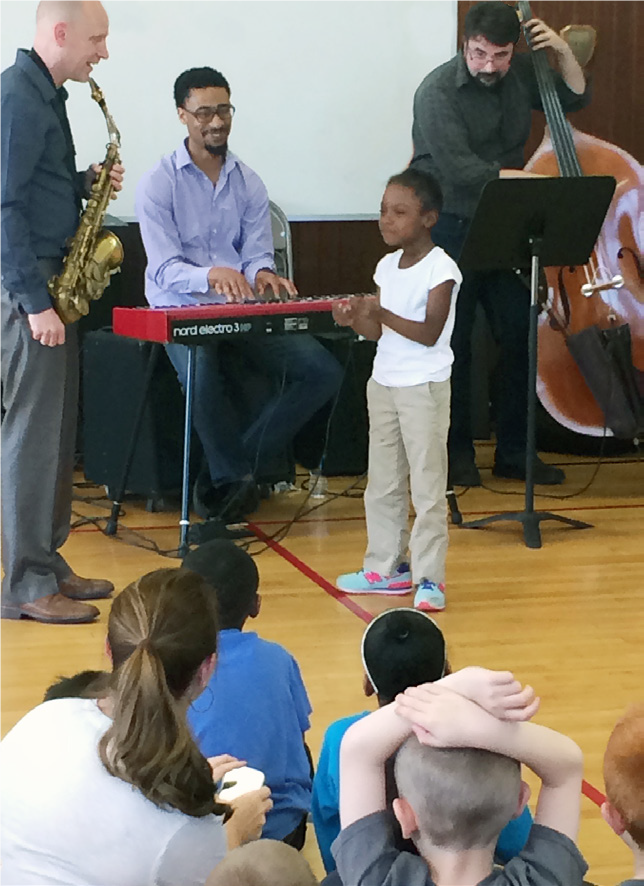 Garfield kid performing with jazz trio