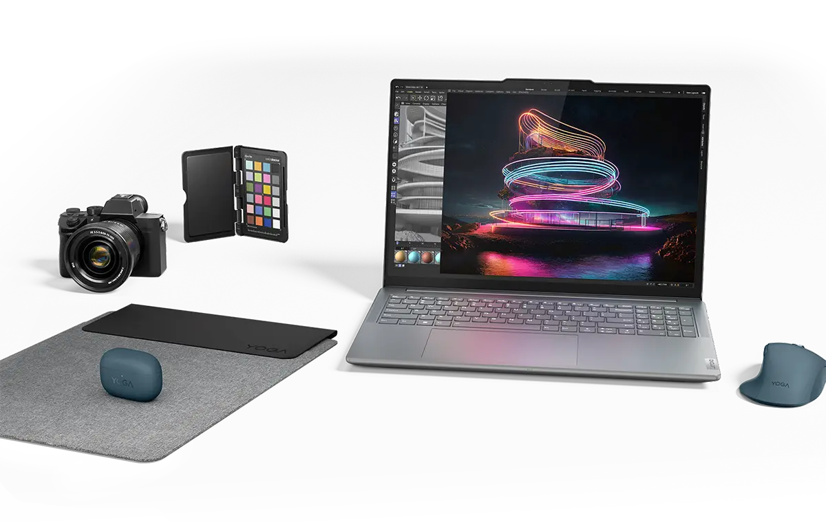 A Lenovo Yoga laptop amidst a variety of accessories and devices