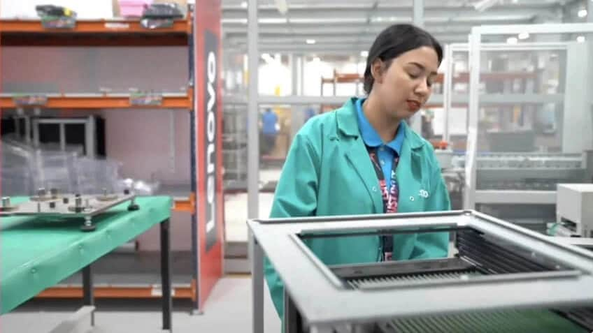 A technician working on Lenovo equipment