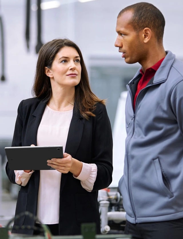 Two colleagues collaborating with a tablet