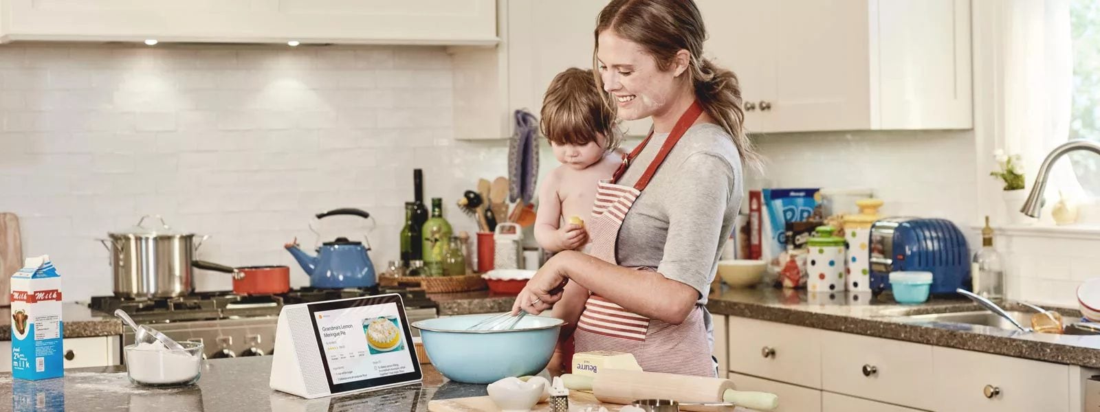 Mom and her daughter learning to make lemon pie in the kitchen