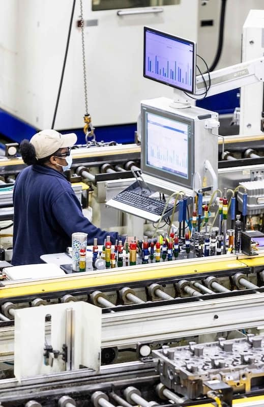 Image of a woman working in a Paccar factory.