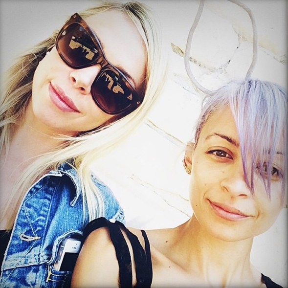 Nicole Richie keeps her hair and her head festive for an egg hunt.