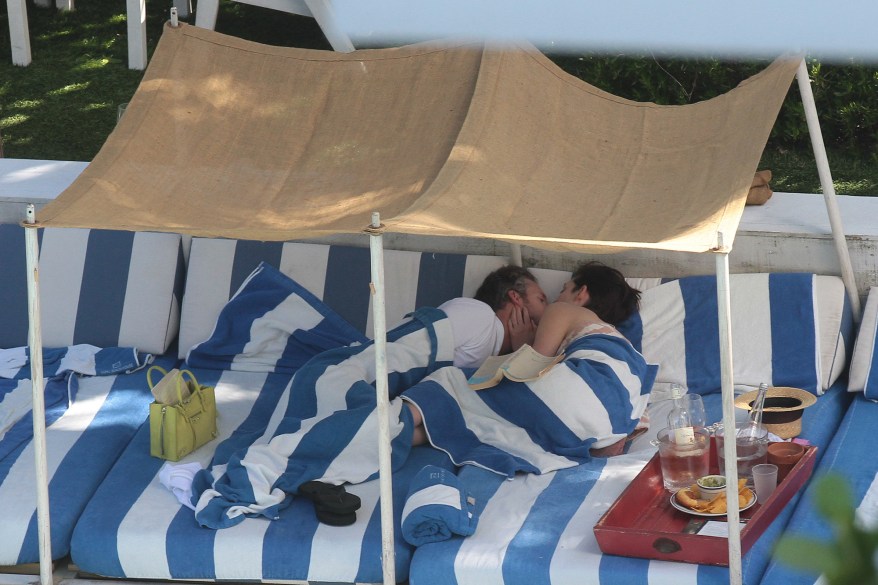 Anne Hathaway and husband Adam Shulman indulged in a little PDA by the pool in Miami Beach. Pictured: Anne Hathaway and Adam Shulman Ref: SPL715997 090314 Picture by: MCCFL / Splash News Splash News and Pictures Los Angeles: 310-821-2666 New York: 212-619-2666 London: 870-934-2666 photodesk@splashnews.com