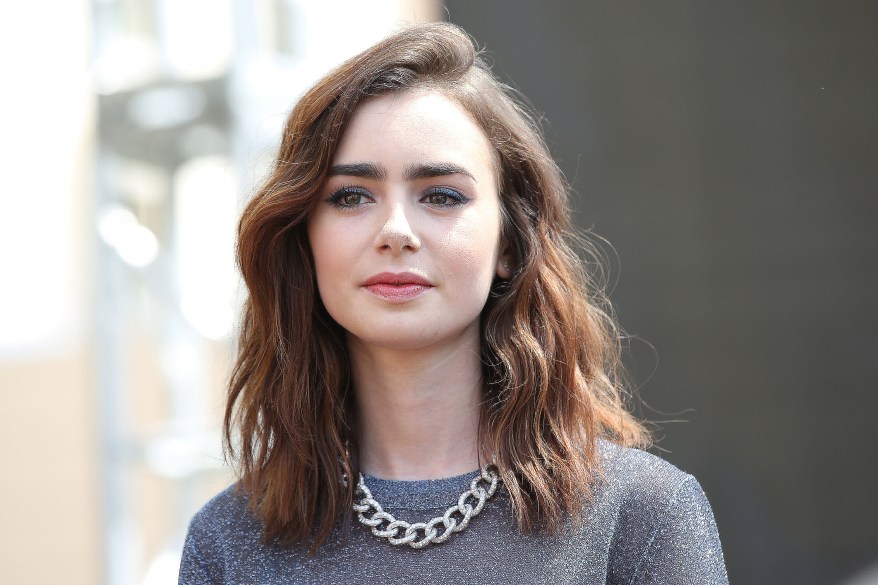 GLENDALE, CA - AUGUST 13: Lily Collins attends the 'The Mortal Instruments: City Of Bones' meet and greet at The Americana at Brand on August 13, 2013 in Glendale, California. (Photo by Jonathan Leibson/Getty Images for Sony Pictures)