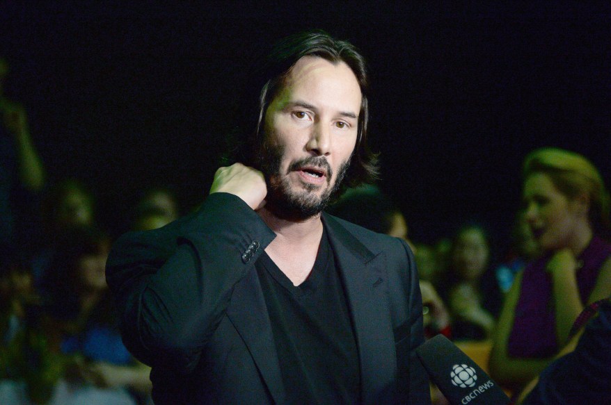 TORONTO, ON - SEPTEMBER 10: Actor and Director Keanu Reeves arrives at the "Man Of Tai Chi" Premiere during the 2013 Toronto International Film Festival at Ryerson Theatre on September 10, 2013 in Toronto, Canada. (Photo by Jason Kempin/Getty Images)