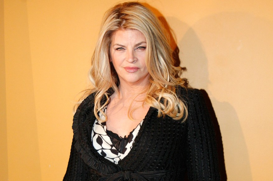 Actress Kirstie Alley poses for photographers as she arrives at the premiere of "The Runaways" in New York City in this March 17, 2010 file photo. Alley described on November 7, 2012 how she fell in love more than 20 years ago with Travolta, and rejected widespread Hollywood speculation that the "Grease" star is secretly gay. REUTERS/Jessica Rinaldi/Files (UNITED STATES - Tags: ENTERTAINMENT)