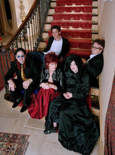 The Osbourne family, from left, are Ozzy, his wife Sharon, daughter Kelly, and son, Jack (in headband) shown in this 2002 publicity photo for their MTV reality series, "The Osbournes." Above them on the stairway at their home in Los Angeles sits Robert Marcato, a family friend whose mother died of the same kind of cancer afflicting Sharon. The show's new 10-episode season begins Nov. 16, airing Tuesdays at 10:30 p.m., EST. (AP Photo/MTV, Mark Weiss/Angles)