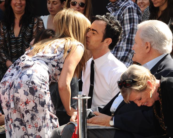 Aniston and Theroux smooch at her Hollywood Walk of Fame induction on Feb. 22, 2012.