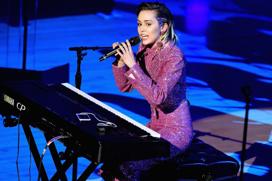 Miley Cyrus performs at the ONE and (RED) campaign's World AIDS Day benefit concert in New York on Tuesday.
