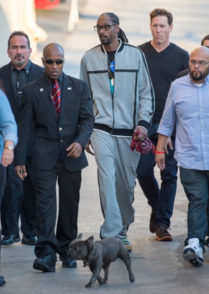 Snoop Dogg is joined by an actual dog as he arrives at "Jimmy Kimmel Live" in Hollywood on Tuesday.