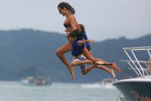 *EXCLUSIVE* **SHOT ON 01/08/16** Florianopolis, Brazil - Alessandra Ambrosio and her daughter Anja Louise enjoy a beach day with friends and family, the mother-daughter duo went for a dive into the warm Ocean waters and enjoyed a BBQ under the overcast weather. AKM-GSI January 9, 2016 To License These Photos, Please Contact : Steve Ginsburg (310) 505-8447 (323) 423-9397 steve@akmgsi.com sales@akmgsi.com or Maria Buda (917) 242-1505 mbuda@akmgsi.com ginsburgspalyinc@gmail.com