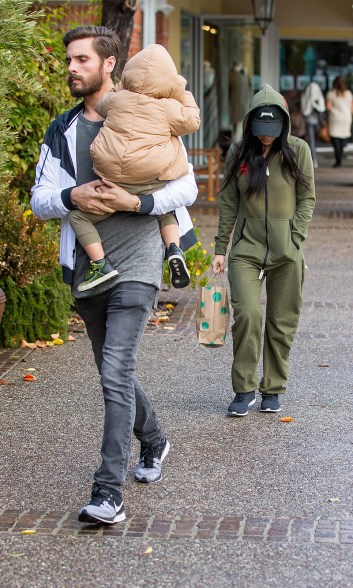 Scott Disick totes Mason after going out to lunch with Kourtney Kardashian in Los Angeles on Wednesday.