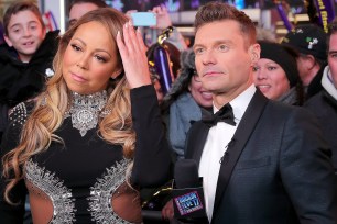 NEW YORK, NY - DECEMBER 31: Mariah Carey and Ryan Seacrest speak during Dick Clark's New Year's Rockin' Eve 2017 at Times Square on December 31, 2016 in New York City. (Photo by Neilson Barnard/DCNYRE2017/Getty Images for dcp)