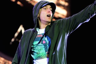CHICAGO, IL - AUGUST 01: Eminem performs at Samsung Galaxy stage during 2014 Lollapalooza Day One at Grant Park on August 1, 2014 in Chicago, Illinois. (Photo by Theo Wargo/Getty Images)