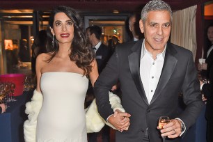PARIS, FRANCE - FEBRUARY 24: George Clooney and Amal Clooney attend the Cesar Dinner at Le Fouquet's on February 24, 2017 in Paris, France. (Photo by Stephane Cardinale - Corbis/Getty Images)