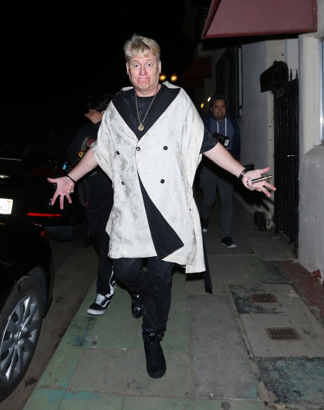 Joe Simpson shows off his unique sense of fashion as he makes funny faces after leaving Warwick night club