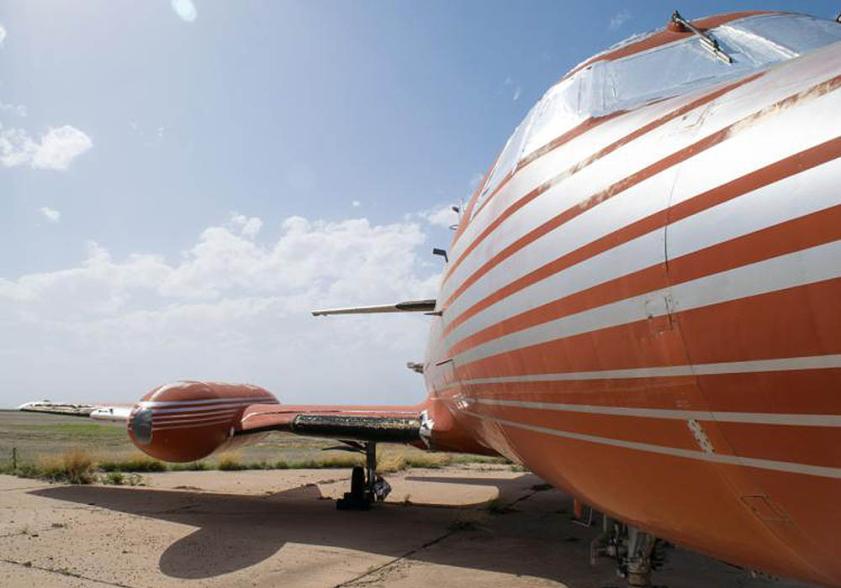 The 1962 red Lockheed JetStarOne, which has been referred to as the 'lost' jet, is expected to fetch over $3.5 million when it is sold at auction on May 27. The aircraft, which is still in its original condition, was one of three jets owned by the legendary singer throughout his life time. This particlauy jet was said to be extra special to Elvis as he owned it with his father Vernon Presley. The jet, which is being listed by GWS Auctions, is currently owned by a private collector who has not been named. The interior was custom designed to Elvis' specifications with gold-tone finishings, woodwork, red velvet seats and a red shag carpet. It also comes with a TV, microwave and a toilet. The jet is one of only 204 aircraft manufactured between 1957 and 1978 in a private project between Jetstar and Lockheed. This aircraft has never been restored and features original external painting and detailing, as well as original interior. The jet is the only airplane once belonging to Elvis that is still owned privately, as the only other two in existence are owned by The Elvis Presley Museum. Pictured: Jet owned by Elvis Presley Ref: SPL1503176 190517 Picture by: Splash News / GWS Auctions Splash News and Pictures Los Angeles: 310-821-2666 New York: 212-619-2666 London: 870-934-2666 photodesk@splashnews.com