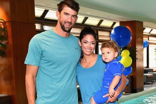 NEW YORK, NY - AUGUST 21: Michael Phelps, Nicole Phelps and Boomer Phelps attendthe Huggies Little Swimmers #trainingfor2032 Swim Class With The Phelps Foundation on August 21, 2017 in New York City. (Photo by Dia Dipasupil/Getty Images for Huggies)