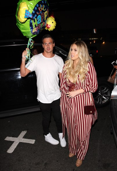 American swimmer Ryan Lochte carries a balloon that reads ‘Happy Birthday’ as he leaves BOA restaurant with friends after having dinner