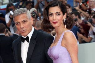 VENICE, ITALY - SEPTEMBER 02: George Clooney and Amal Clooney walk the red carpet ahead of the 'Suburbicon' screening during the 74th Venice Film Festival at Sala Grande on September 2, 2017 in Venice, Italy. (Photo by Elisabetta A. Villa/WireImage)