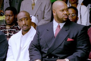 ** ADVANCE FOR WEEKEND OF JULY 12-13--FILE ** Rapper Tupac Shakur (in white) and rap music pioneer Marion "Suge" Knight attend a voter registration event in Los Angeles in this file photo taken Aug.15, 1996. Knight helped muscle rap into the mainstream a decade ago with superstars such as Shakur, Dr. Dre and Snoop Dogg. When Knight was released from prison two years ago, he vowed to return his record company, Death Row Records, to the top of the hip-hop charts. It hasn't happened. The label has yet torelease a hit album by a new artist, and for the second time this year Knight is behind bars. (AP Photo/Frank Wiese)