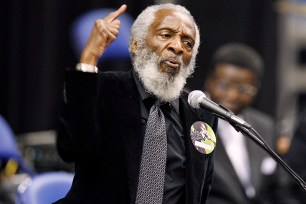 FILE PHOTO - Activist Dick Gregory delivers a speech during a public viewing and funeral for legendary singer James Brown in Augusta, Georgia December 30, 2006. REUTERS/Lucas Jackson/File Photo