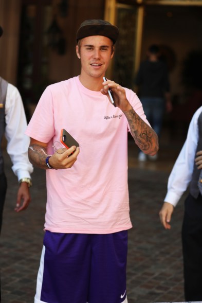 Justin Bieber hops out out of his Mercedes SUV in Beverly Hills