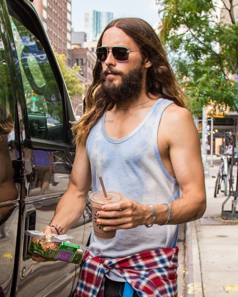 Jared Leto shows off his colorful nail polish as he departs his hotel in New York City