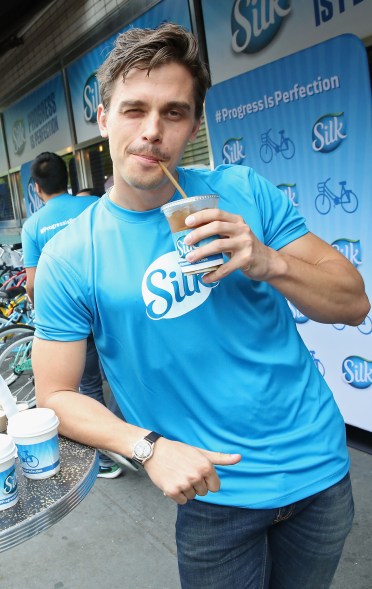 Antoni Porowski from "Queer Eye for the Straight Guy" sips on a Silk iced coffee as he celebrates Bike to Work Week.