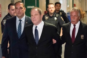 Harvey Weinstein being walked into Manhattan Supreme court