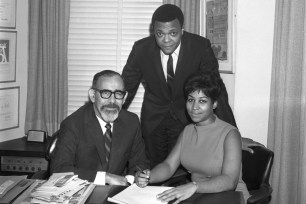 Aretha Franklin signing her record contract with Atlantic Records in 1966 alongside her husband and manager Ted White (Top) and Jerry Wexler.