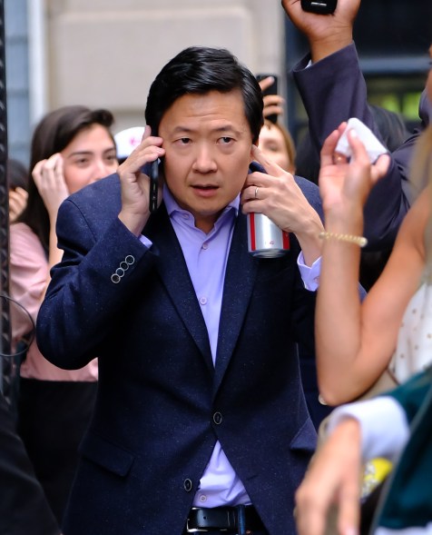 Ken Jeong struggles to hear his cell phone amid loud fans at AOL Live.