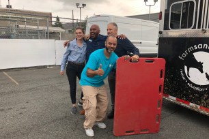 Jon Stewart poses with fellow rescuers